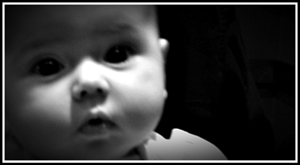 A framed black and white portrait of Ella