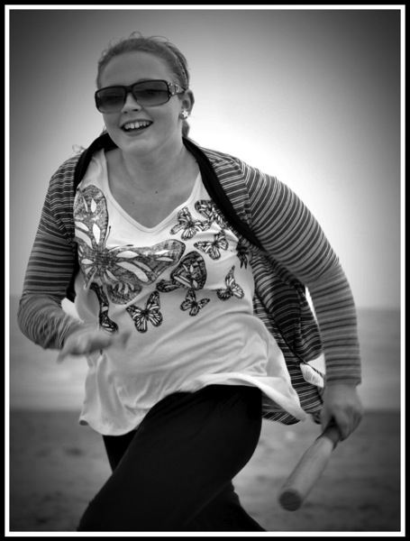 Maddie running while playing rounders