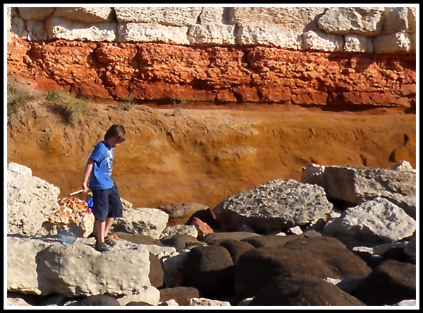 Marshall climbing rocks and looking for crabs etc...