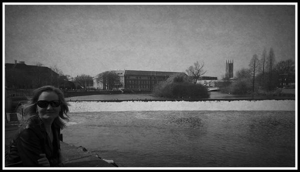 Sarah next to the river with the Cathedral in the background.jpg