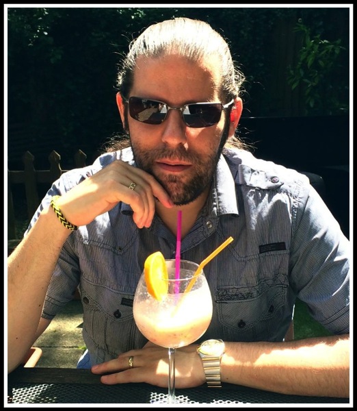 Me relaxing with a refreshing drink in Sicily restaurant garden