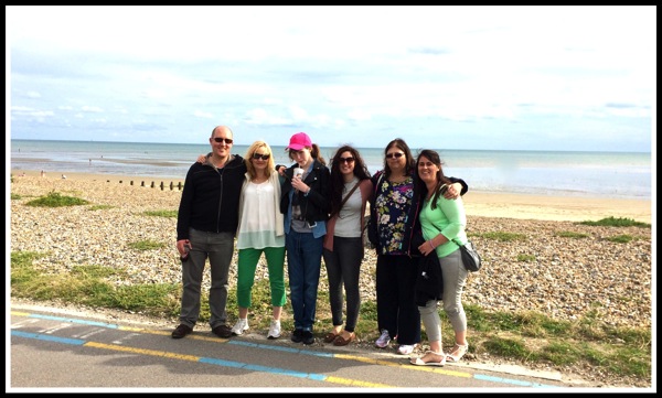 Group photo in front of the beach and sea 
