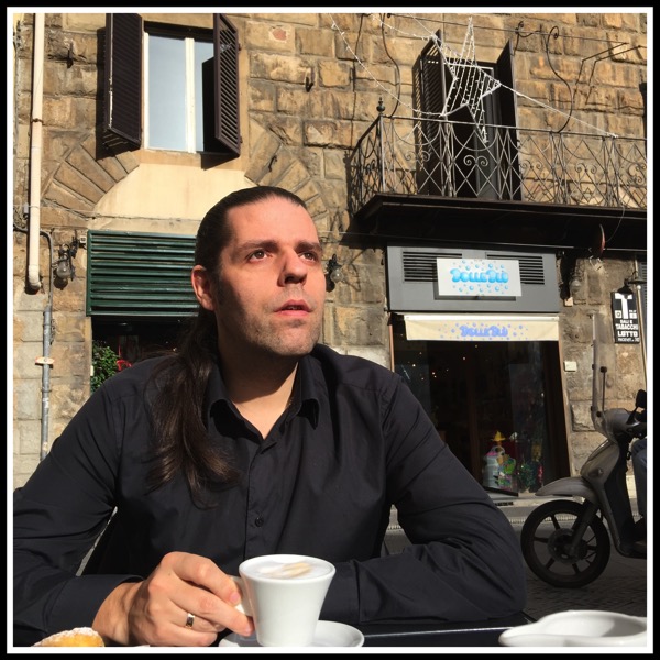 Me sat drinking coffee outside staring at the sun