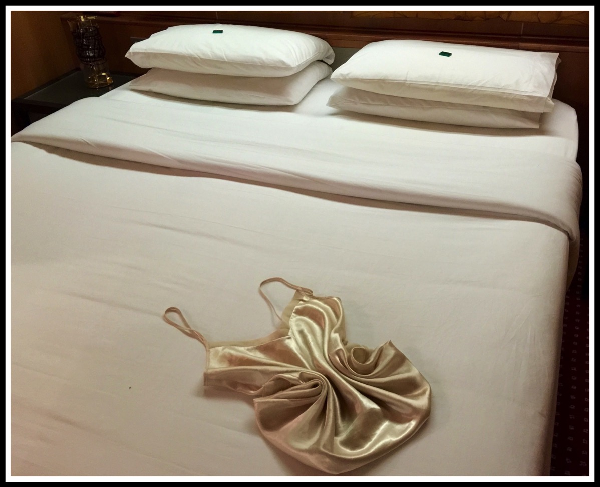 a photo of the folded bed covers and Sarahs Folded Nightie 2