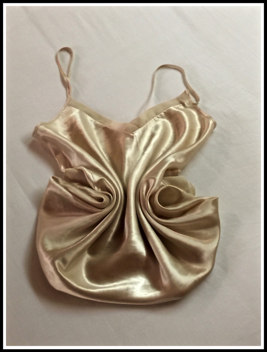 a close up shot of the fantastic pattern folded by the cabin steward on Sarah nightie