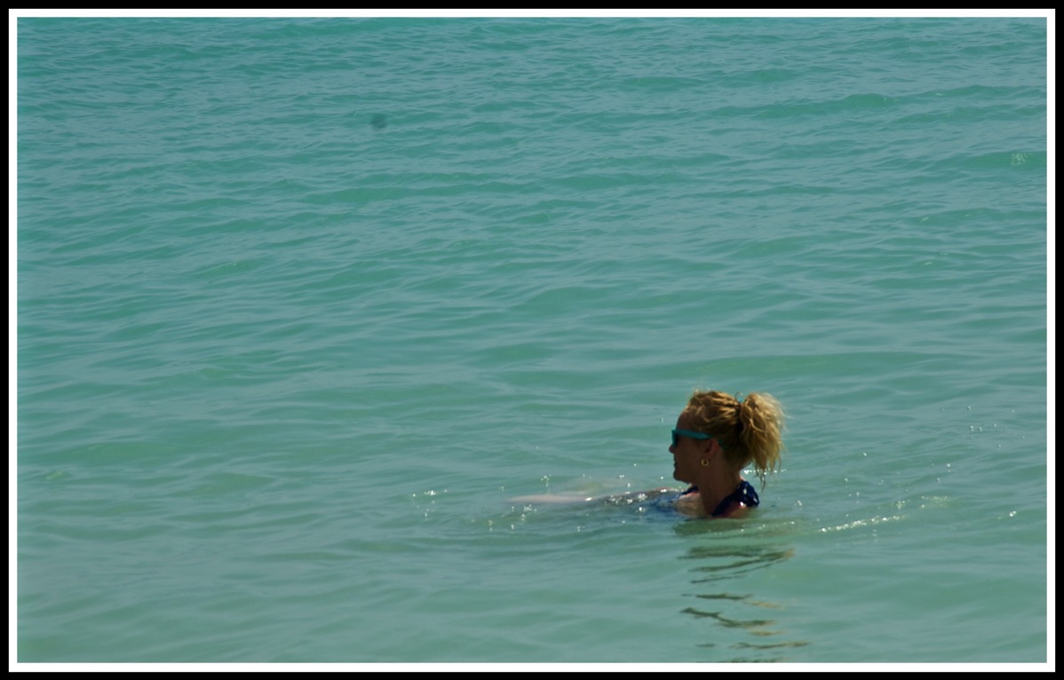 A full photo of just sea, with Sarah head poking out in the bottom right corner