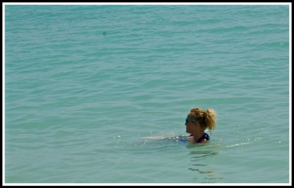 A full photo of just sea, with Sarah head poking out in the bottom right corner