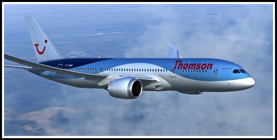 A photo of the Thomson 787 Dreamliner in flight above the clouds, flying from left to right