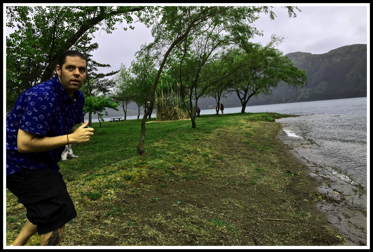 Me looking Terrified in front of the river with volcanic rocks behind