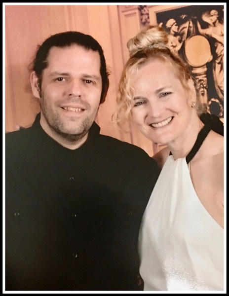 Me on the left wearing a black shirt and Sarah on the right wearing a beautiful while dress with a black ribbon tie