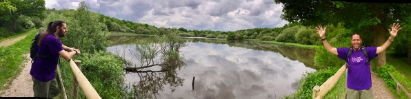 on the left i'm leaning on a fence overlooking a large pond while on the right i'm waving with both arms in the air and smiling at the camera!