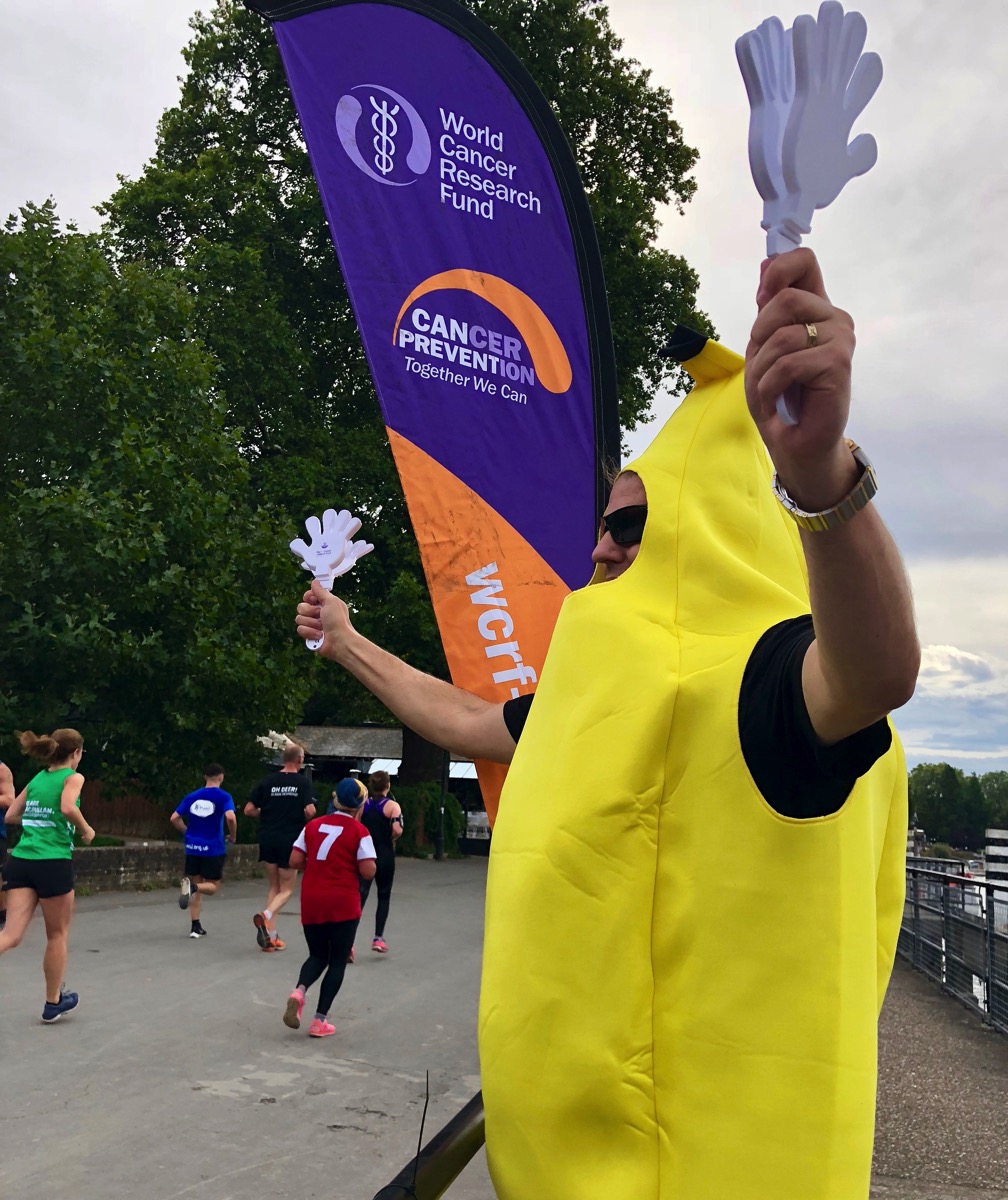 Me wearing the bright yellow banana suit and cheering on the runners