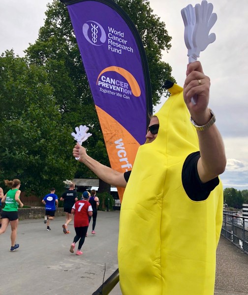 Me wearing the bright yellow banana suit and cheering on the runners