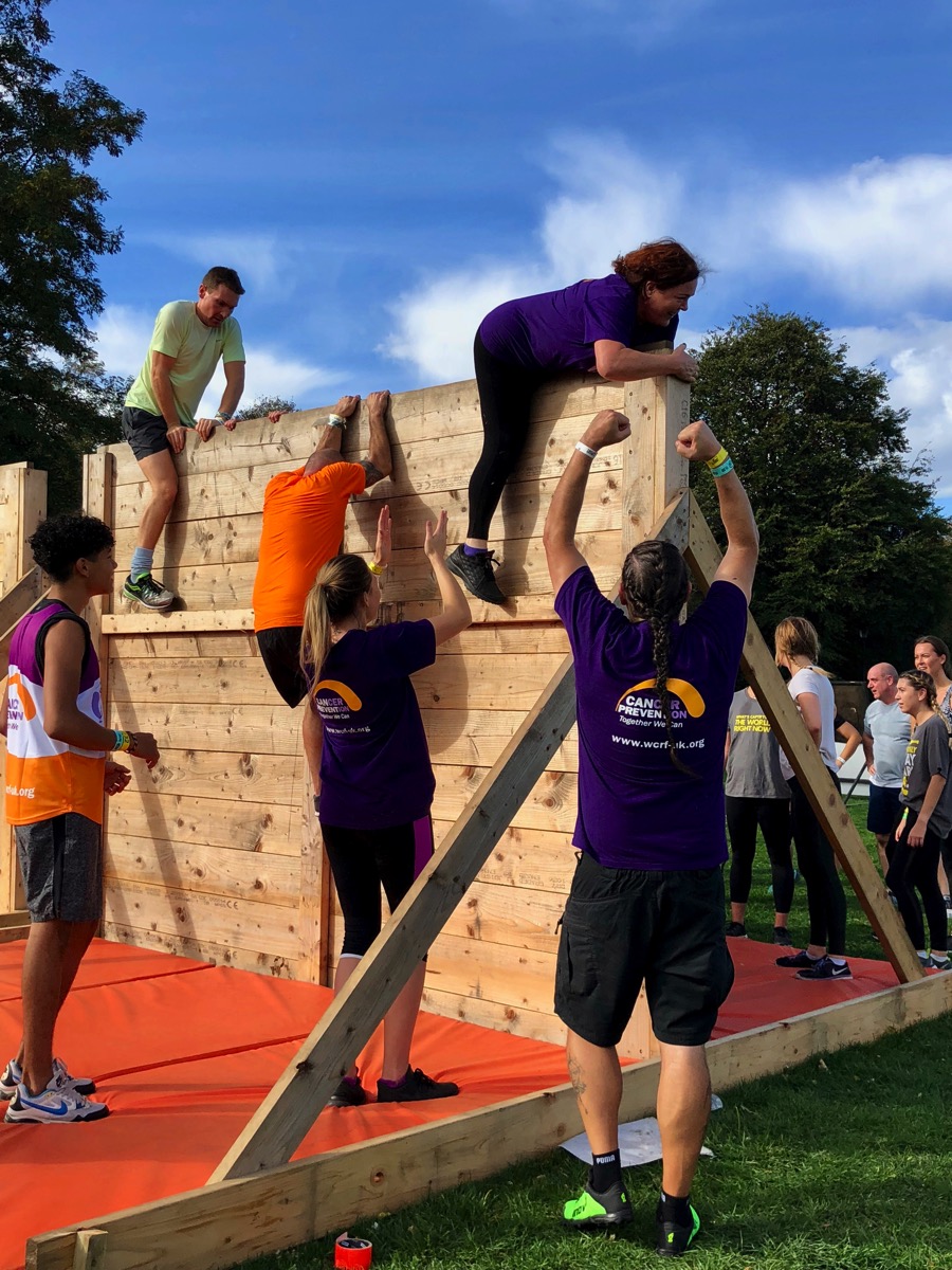 Josie on the top of the wall with all of us cheering at the bottom