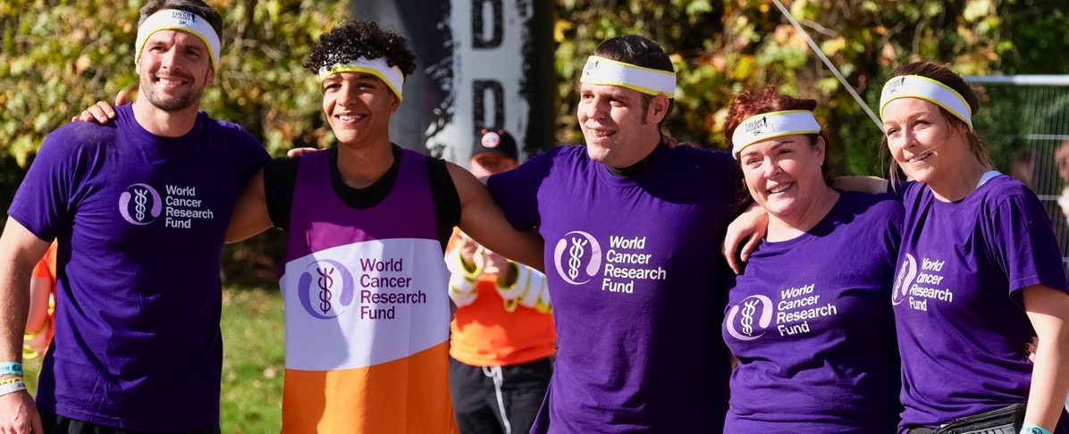 A photo of the hard as nails team with our headbands on and our arms around each other