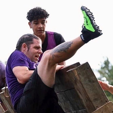 Vini on top of the wall and me trying get my leg up to get grip for my pull up!