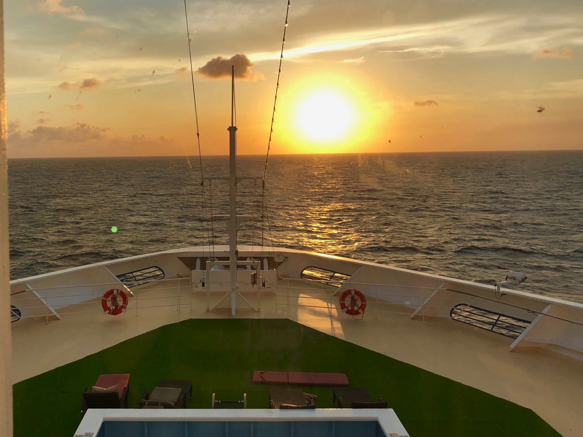 A view of a sunset from our cabin on the Marella Explorer looking directly forward and centre at the front of the ship