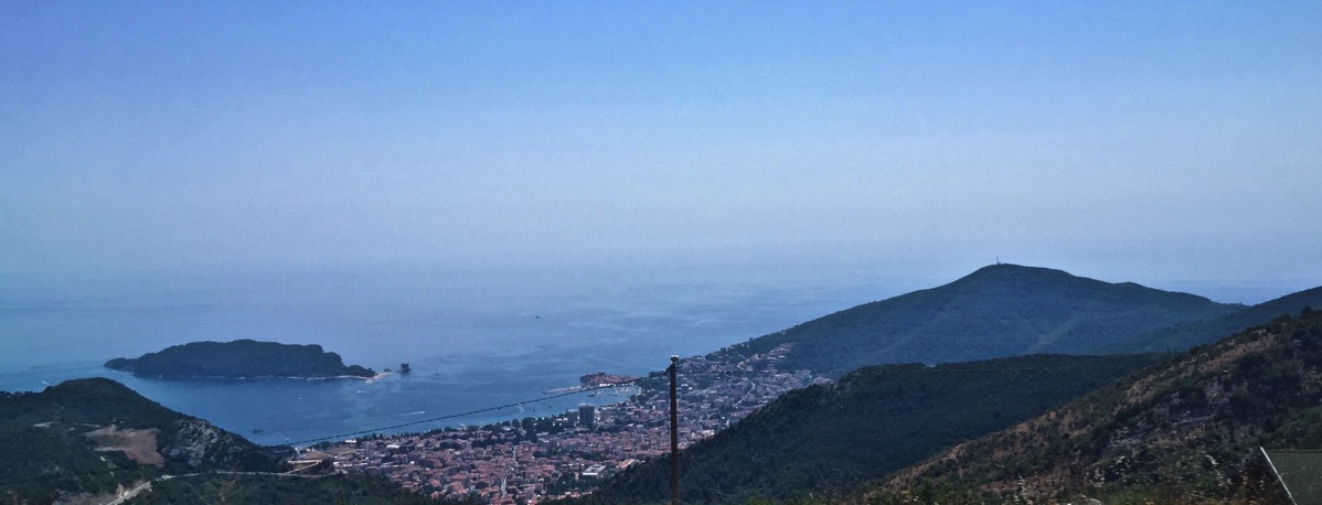 Another Sarah panorama of the sea surround by mountainous hills 