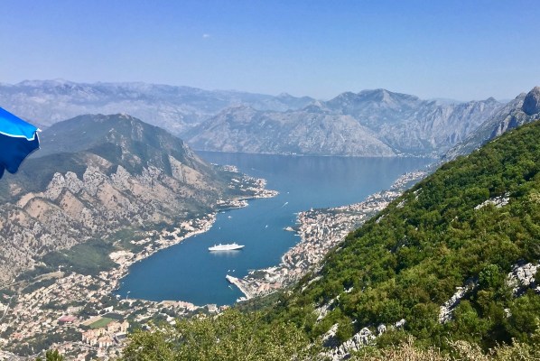 incredible shot of the surrounding mountains and then looking down to the ship at the bottom of the valley