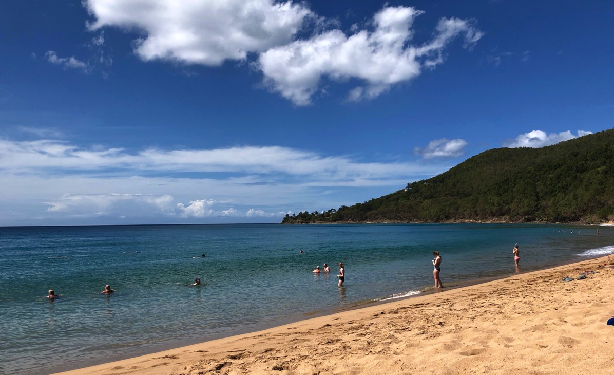 Beach and sea landscape with the coast line entering the sea
