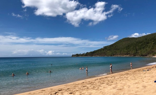 Beach and sea landscape with the coast line entering the sea