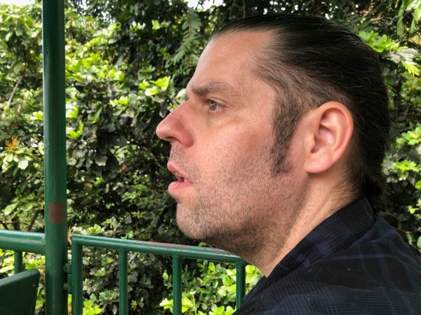 close side profile of my face as Sarah is sat right next to me and the rain forest behind me