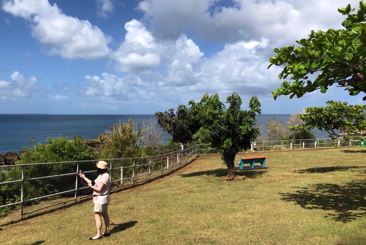 Landscape shot of the island shore line with a steel fence arond
