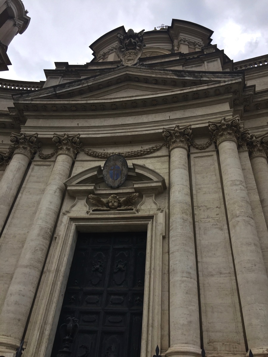 looking upwards at a fantastic building stood at the entrance