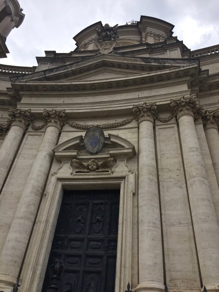 looking upwards at a fantastic building stood at the entrance