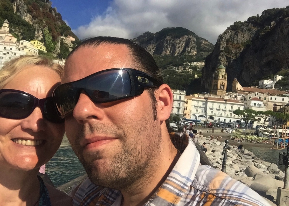 Me and Sarah in a selfie with our sunglasses on and the mountains in the background
