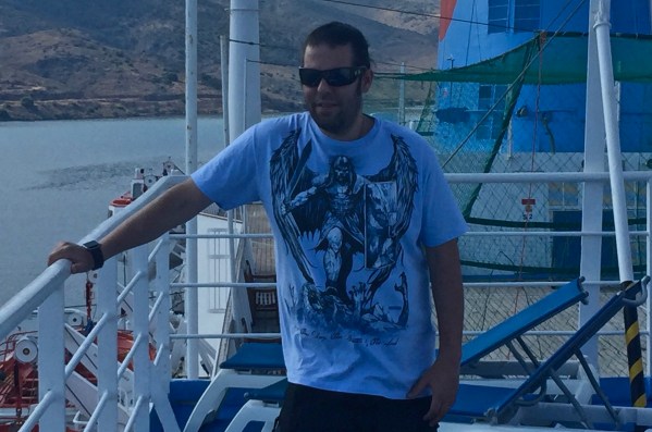 Me atood on the deck with my new shirt on with arch angel Michael fighting Satan