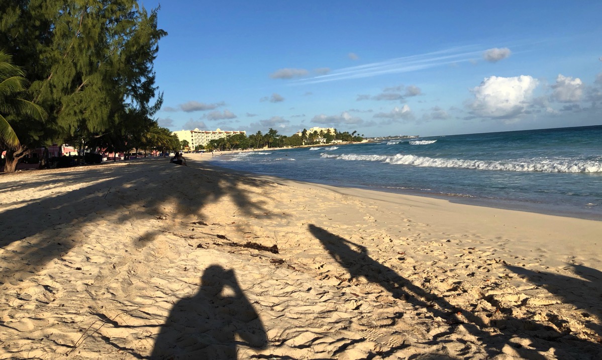 Sarah shadow across the beach looking over the whole bay of Barbados