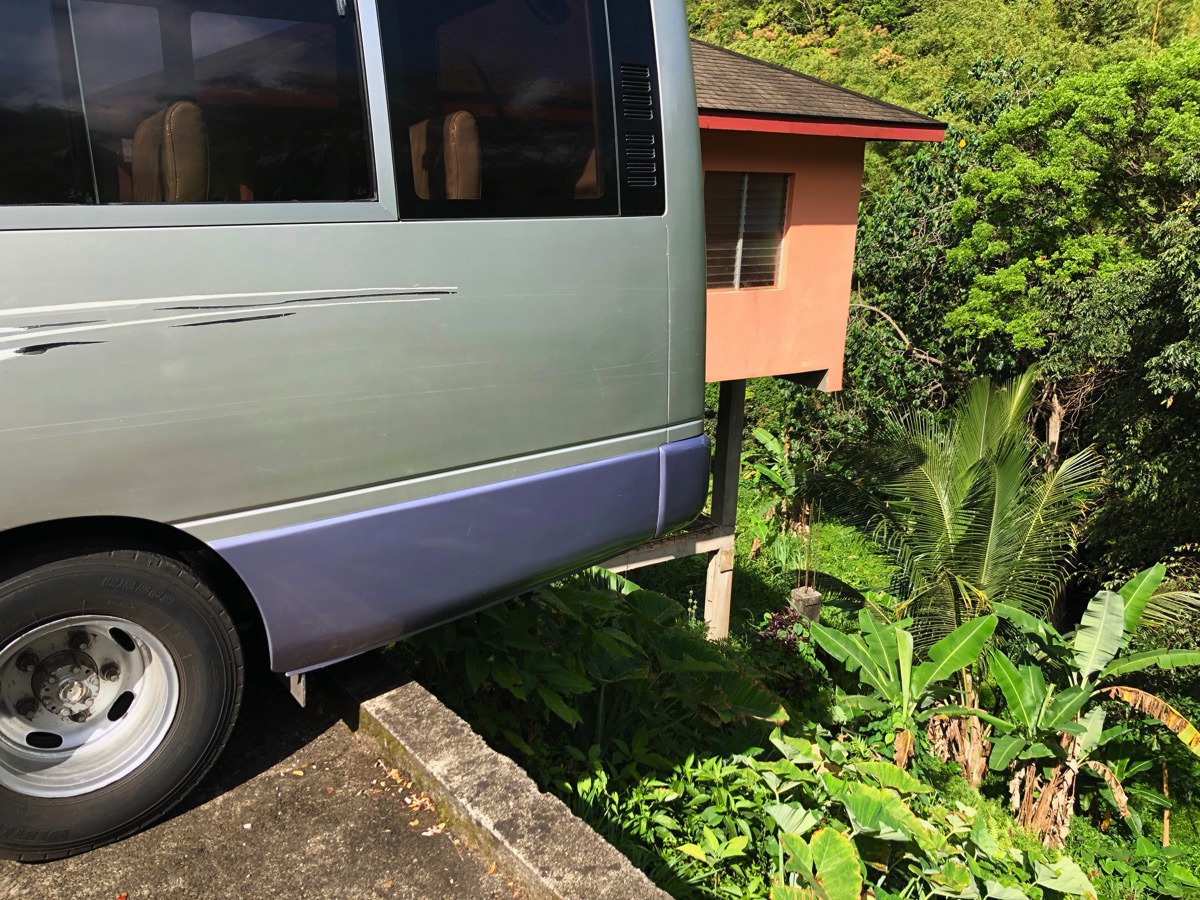 the bus rear whell is so close to a sheer drop off the cliff