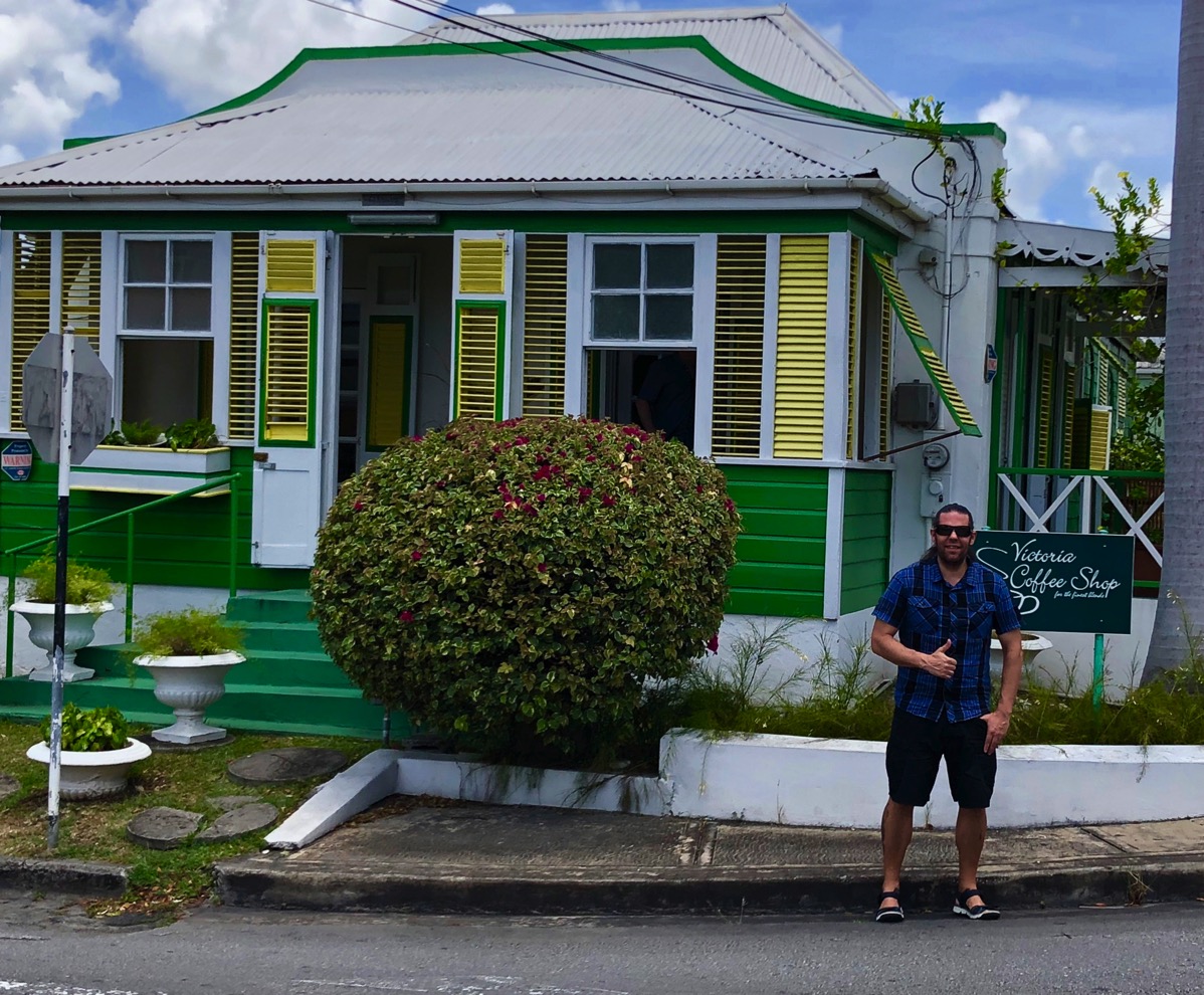 Me stood outside the coffee shop with my thumb up