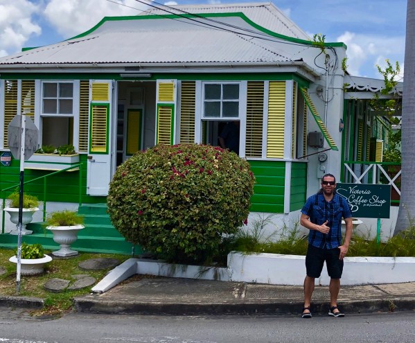 Me stood outside the coffee shop with my thumb up