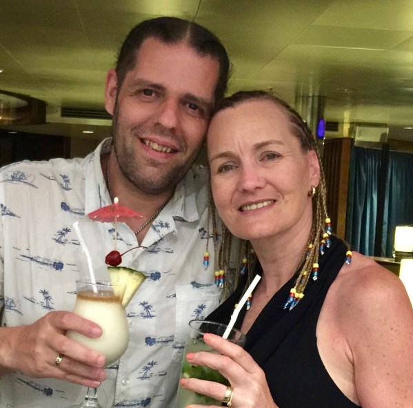 Me on the left with arms around sarah and both smiling at the camera with braided hair and a cocktal in hand