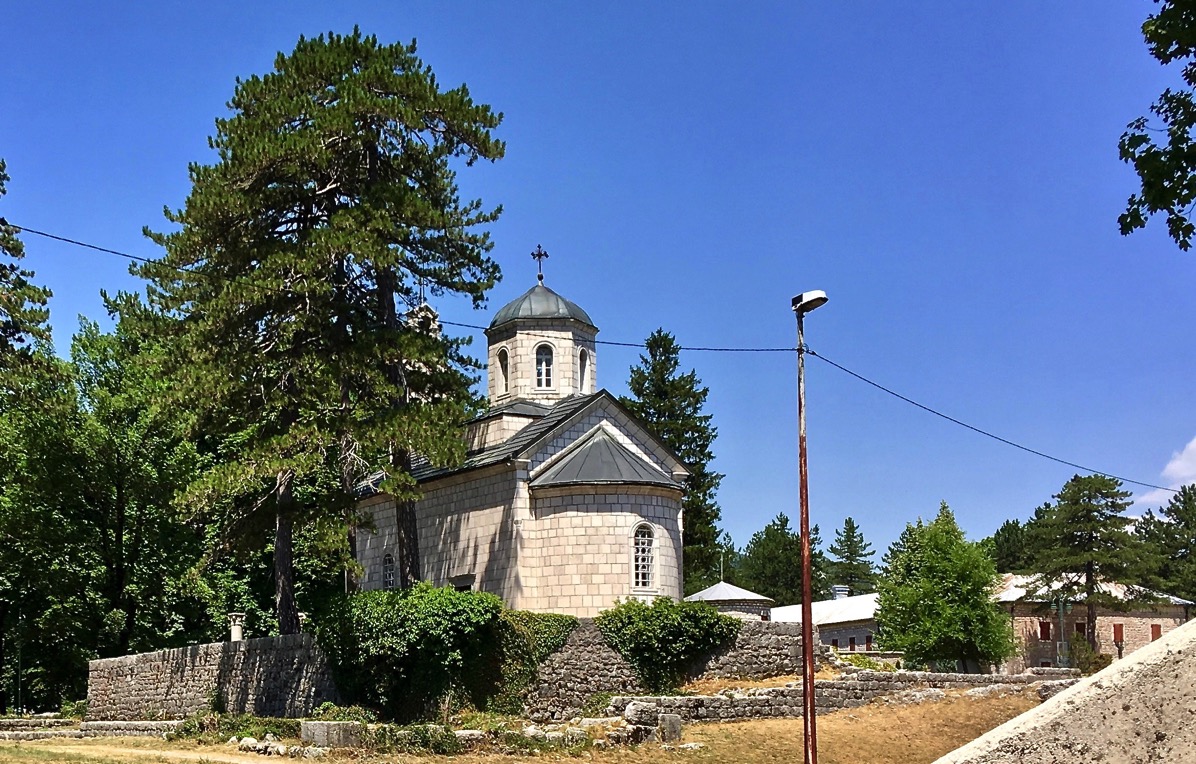 Old churh building amongost some trees