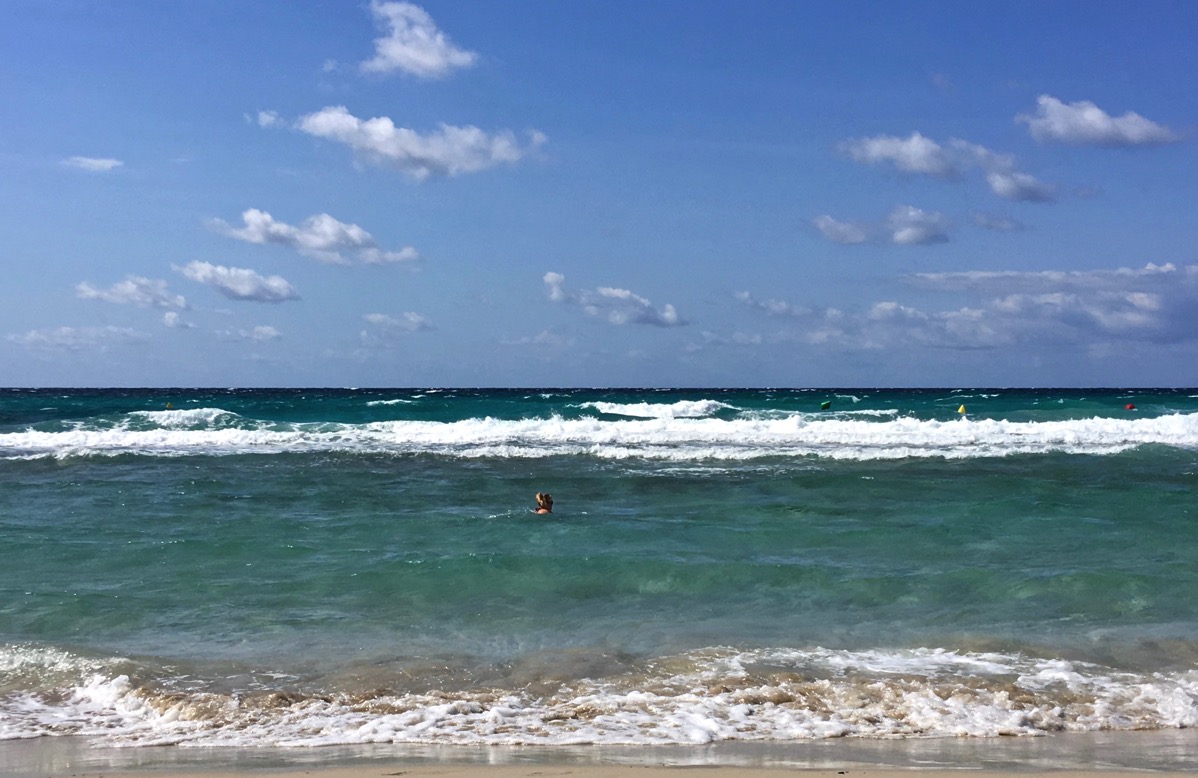 Sarah's head just visable in the sea in Minorca