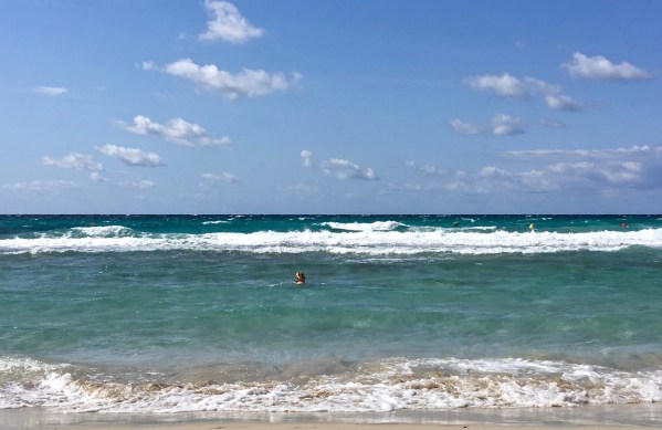 Sarah's head just visable in the sea in Minorca
