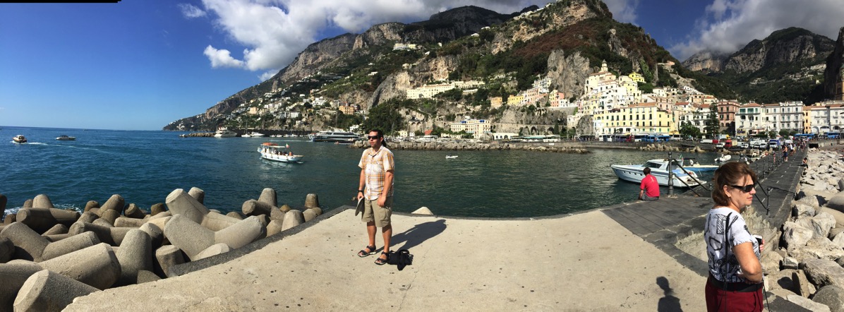 Sarah panorama of the Amalfi sea, road and mountains in the background and me in the centre of the photo