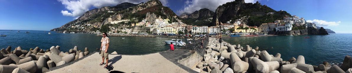 Sarah panorama of the Amalfi sea, road and mountains in the background and me in the centre of the photo