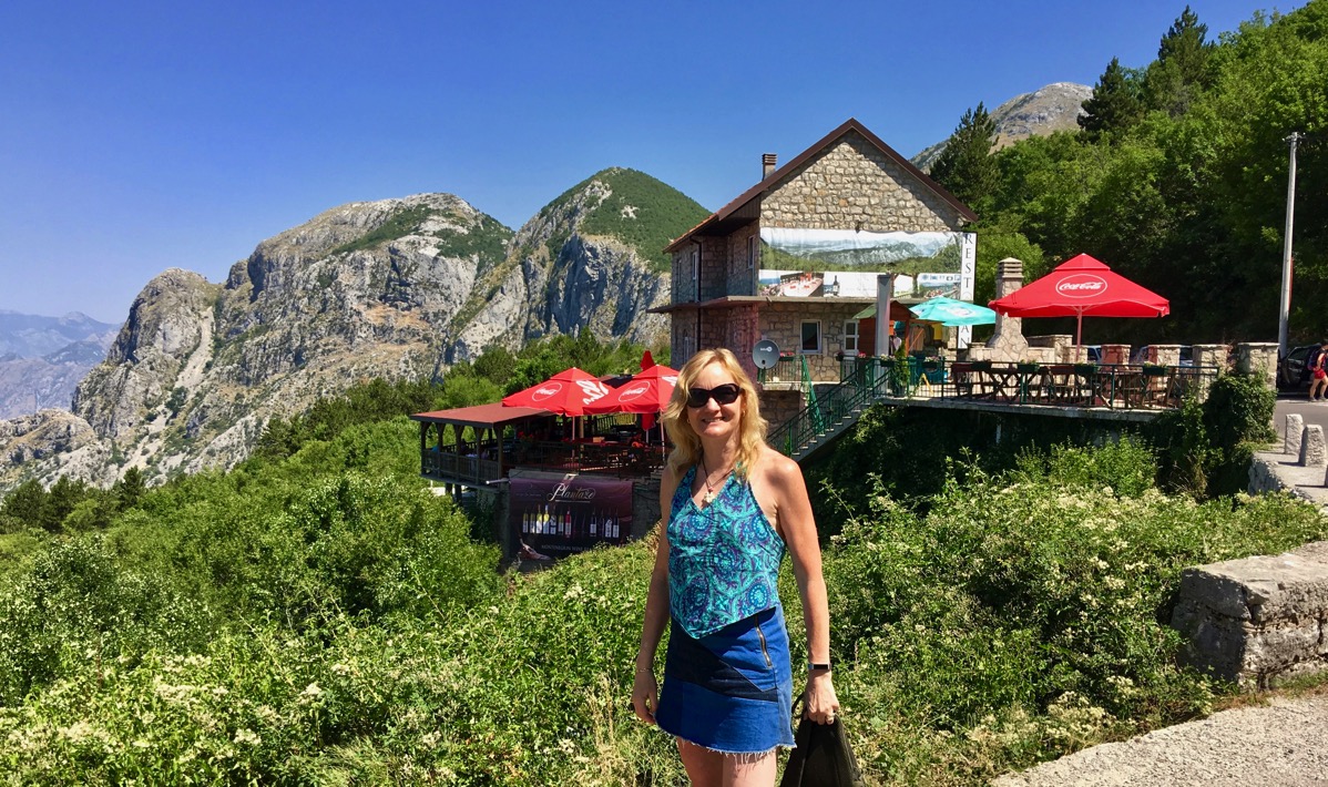 Sarah stood in front of the mountain top bar/restaurant