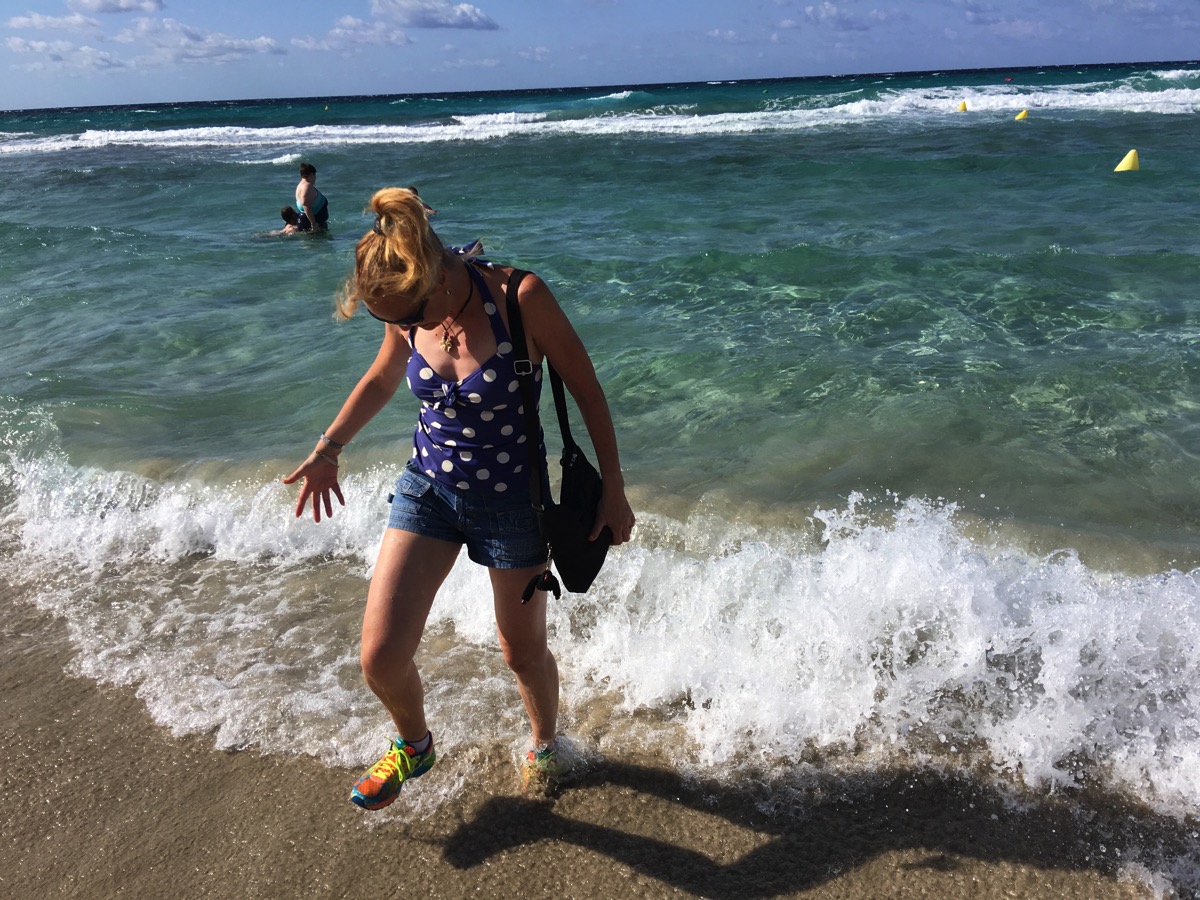 Sarah walking in the sea ath Minorca