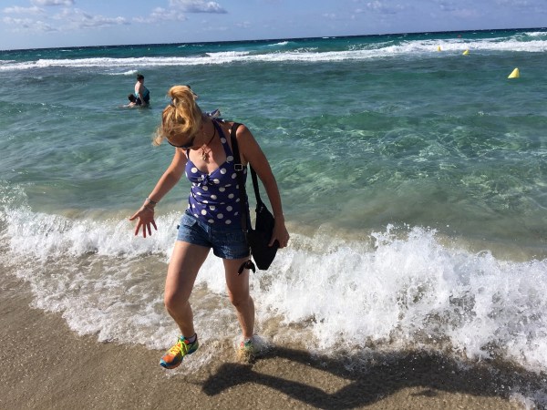 Sarah walking in the sea ath Minorca