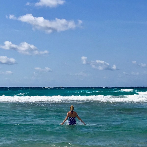 Sarah walking in the sea ath Minorca