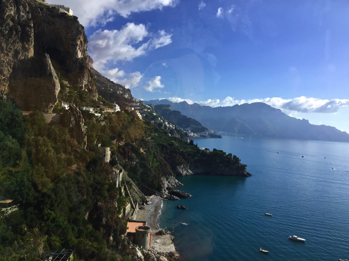 The beautiful Amalfi coast and te town buldings and rolling hills and mountains