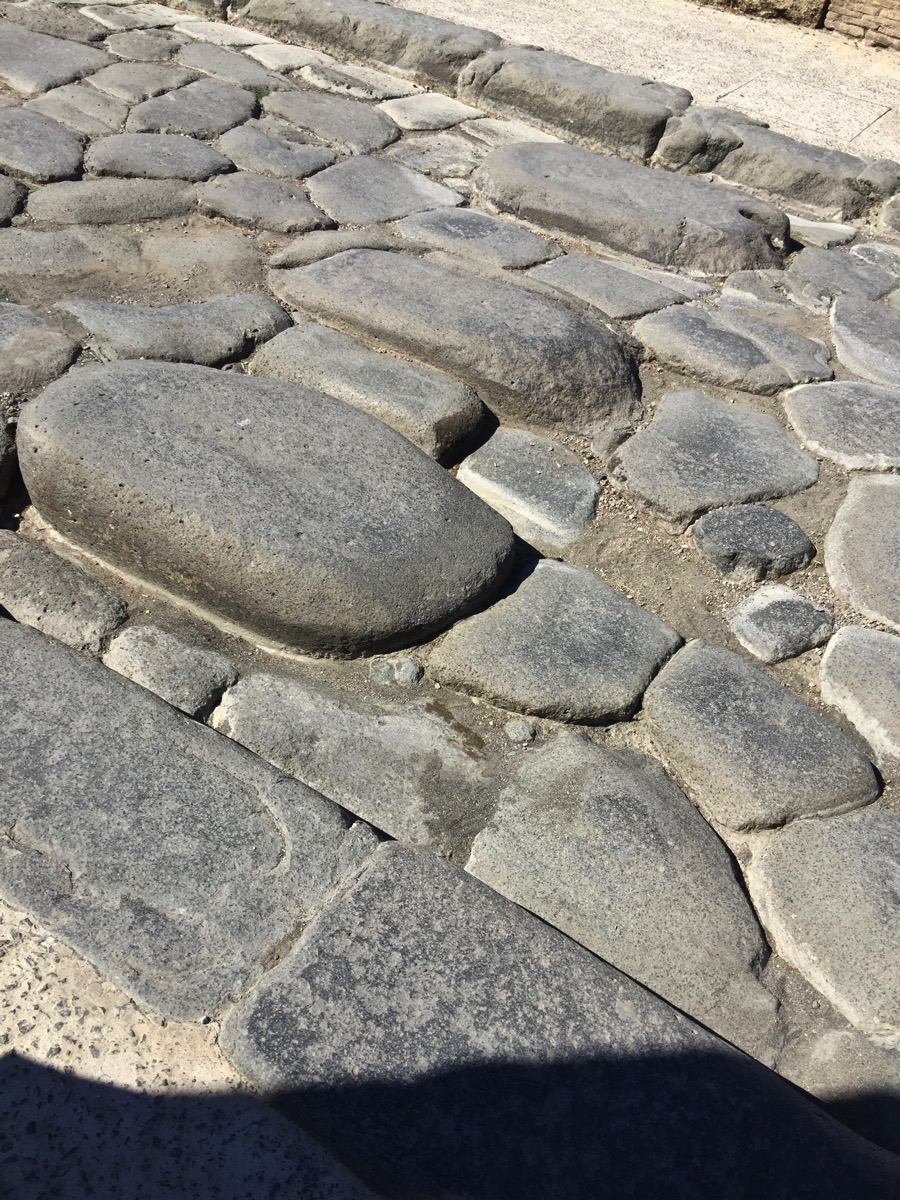 The main road which is crumpled and cracked but nicely maintained