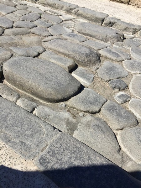 The main road which is crumpled and cracked but nicely maintained