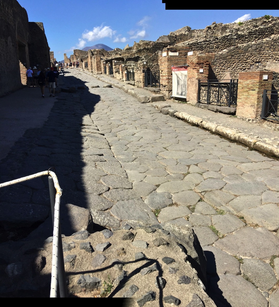 The main road which is crumpled and cracked but nicely maintained