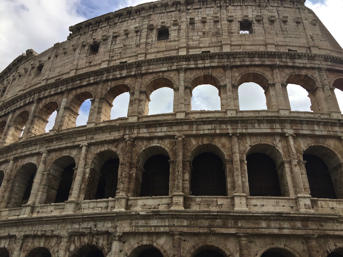 The outside of the Colosseum with all of the arches